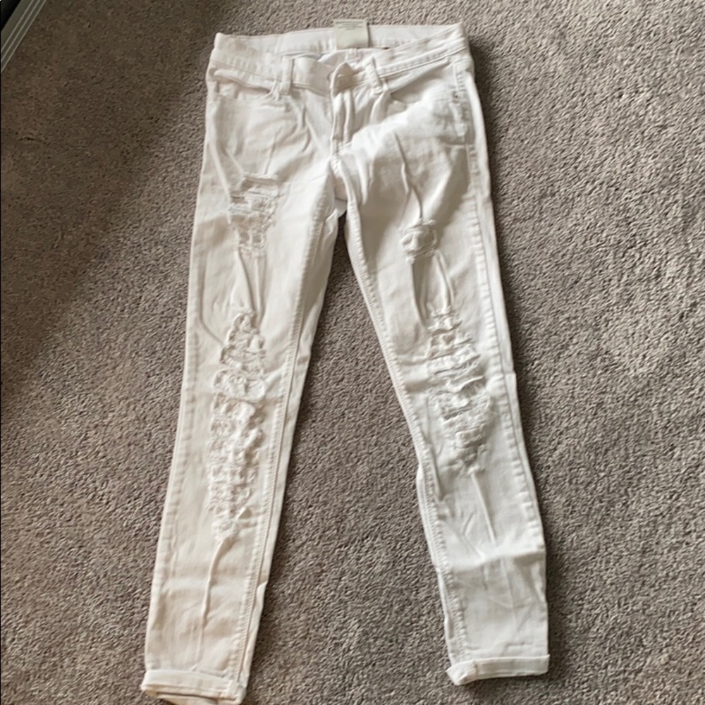 Ripped white skinny ankle jeans